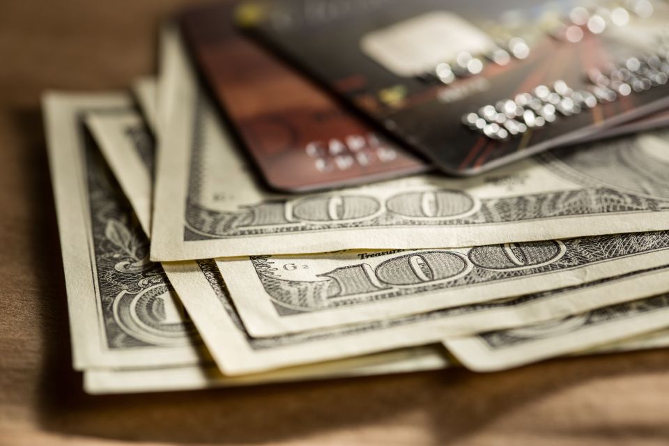 Credit cards and dollars in cash