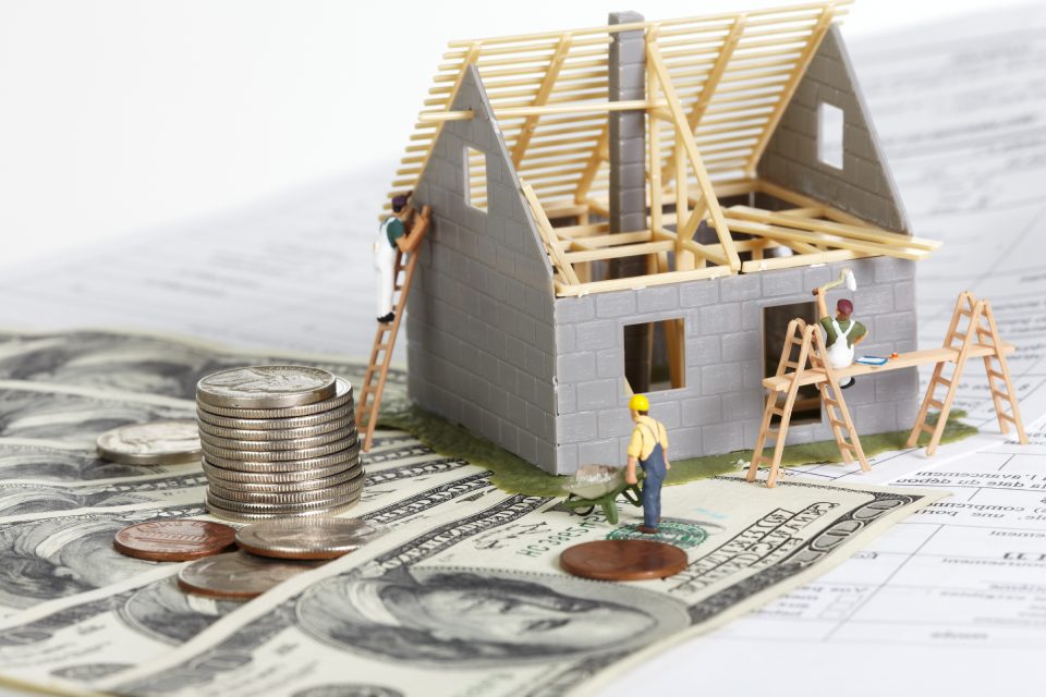 Family house with money. Construction background.