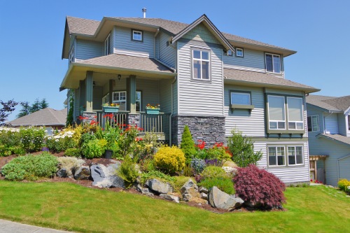 Unusual Family House With Landscaping On The Front And Blue