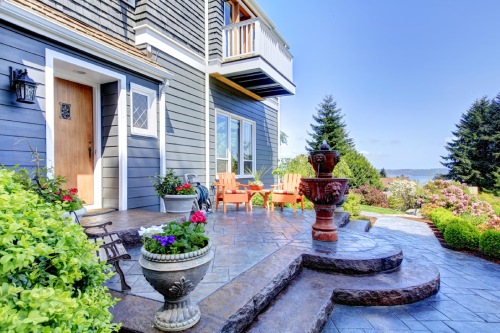 Front OF The Blue Luxury House Exterior With Fountain