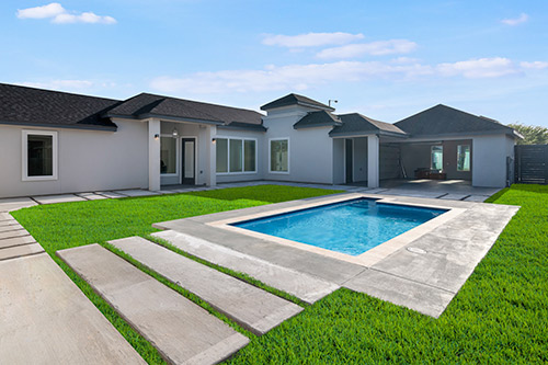 Luxury backyard pool at day 