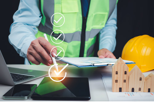 Builder doing a checklist for a building construction planning 
